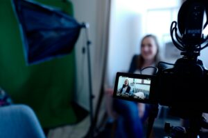 photo shows a woman being interviewed