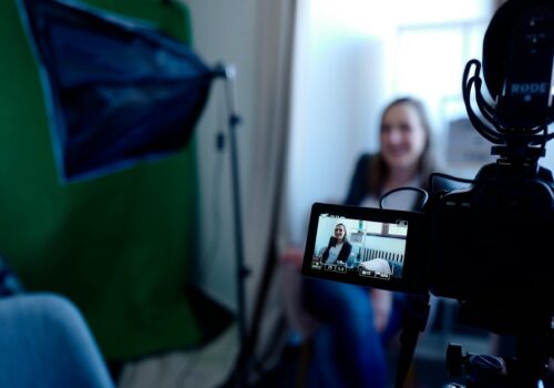 photo shows a woman being interviewed